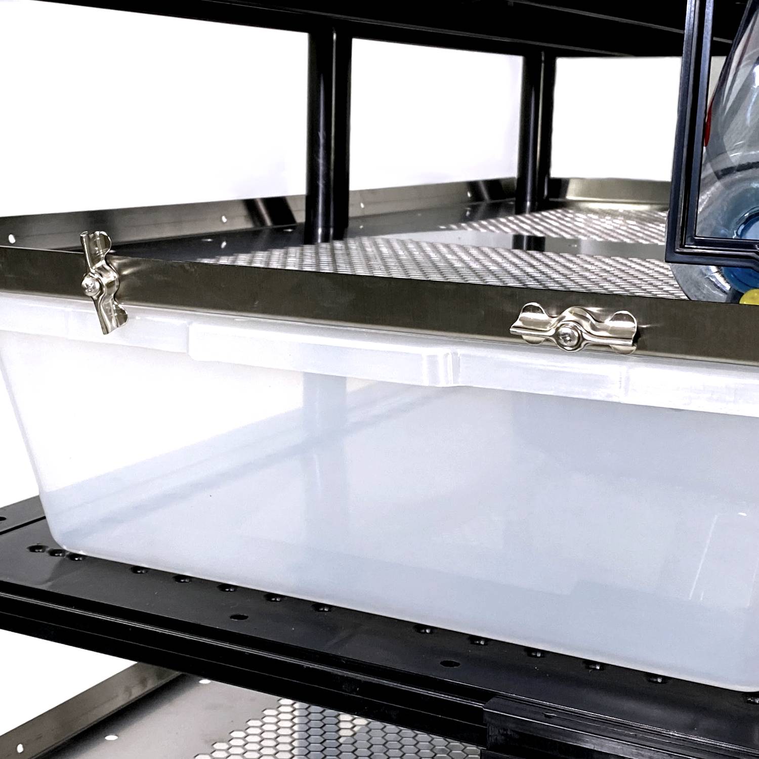 Vision Products rodent rack tub security clip on a rack