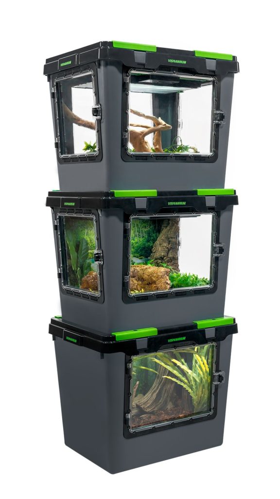 three Visionarium reptile enclosures with natural decor stacked on top of each other